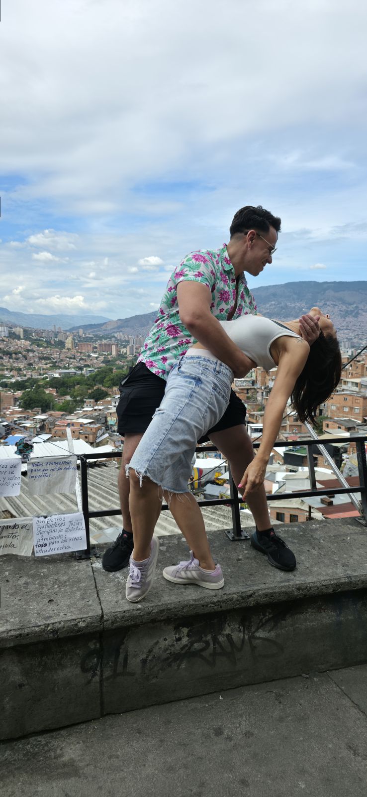 Couple dancing at a city overlook