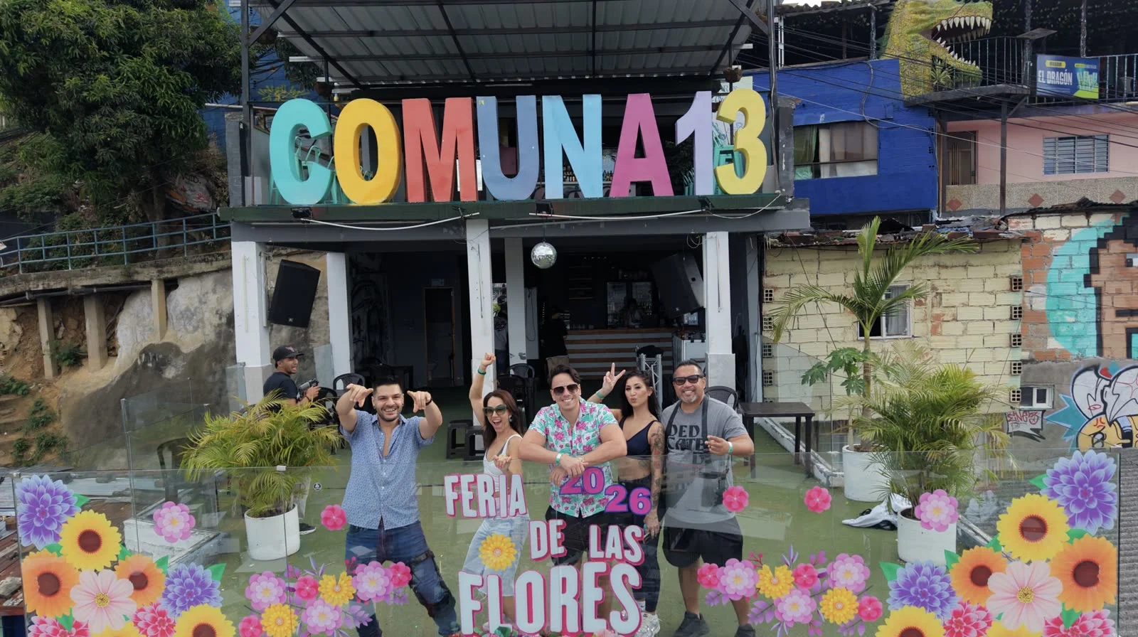 Group at the Comuna 13 sign in Medellín