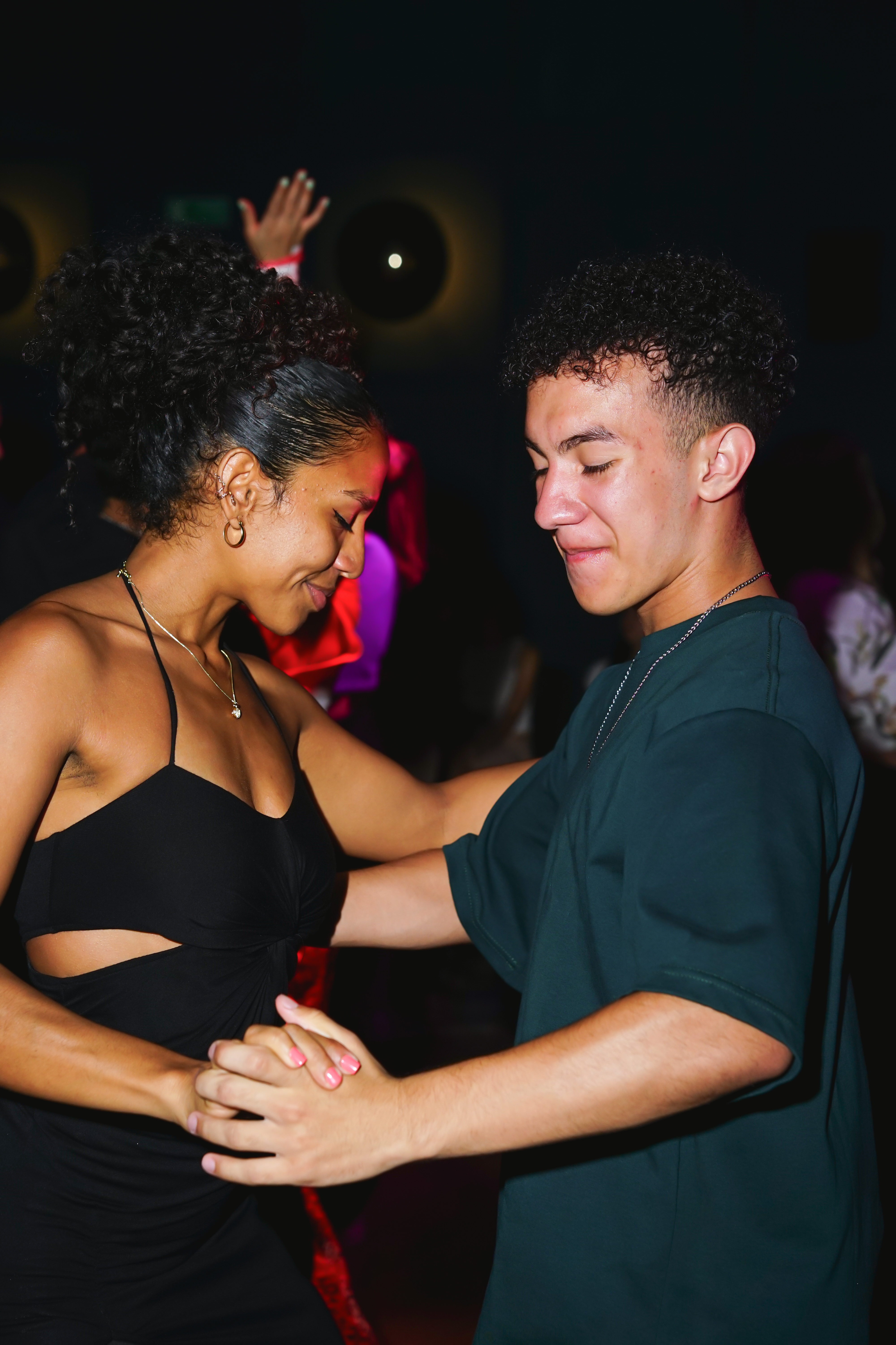 Close view of two partners connecting during a social dance